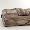 Inspired by the wild game of Africa, but reinterpreted in a watercolor abstracted way in bronze, taupe and earth colors on sateen. Duvet has hidden button closure. Duvets, shams and comforters are self-reversing.