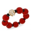 Seeing red is a good thing with this stretch bracelet from Haskell. Gold-tone and black details, as well as glass accents, add to the appeal. Approximate length: 7-1/2 inches.