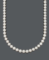 Indulge in the everlasting elegance of pearls. This beautiful Belle de Mer necklace features AA cultured freshwater pearls (10-11 mm) with a 14k gold clasp. Approximate length: 20 inches. Indulge in the everlasting elegance of pearls. This beautiful Belle de Mer necklace features AA cultured freshwater pearls (10-11 mm) with a 14k gold clasp. Approximate length: 20 inches.