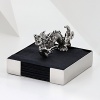 The grand form of a mythical dragon was the muse behind this sculptural, hand-cast napkin holder from Natori.