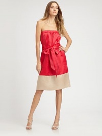 Shimmering strapless confection in a colorblock design has a flattering self tie that concludes with an oversized bow. StraplessSelf tie at waistPull-on styleAbout 16 from natural waist63% silk/37% linenDry cleanImportedModel shown is 5'10 (177cm) wearing US size Small. Shimmering strapless confection in a colorblock design has a flattering self tie that concludes with an oversized bow. StraplessSelf tie at waistPull-on styleAbout 16 from natural waist63% silk/37% linenDry cleanImportedModel shown is 5'10 (177cm) wearing US size Small.