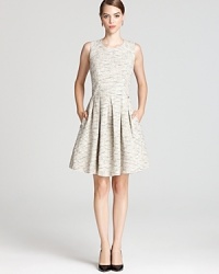 Winter white tweed lends a fresh, ladylike look to Shoshanna's fit-and-flare dress, rendered with a playful pleated skirt. Winter white tweed lends a fresh, ladylike look to Shoshanna's fit-and-flare dress, rendered with a playful pleated skirt.