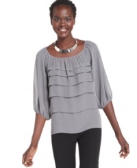 Studio M's tiered blouse features a feminine fit and a scoop neckline worthy of a statement necklace! Studio M's tiered blouse features a feminine fit and a scoop neckline worthy of a statement necklace!