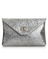 Every girl needs a little glitter on an evening out and this clutch from Style&co. is pretty perfect. Glam sequin adorns the design for instant eye-catching sparkle, while subtle silver-tone hardware offers extra dimension.