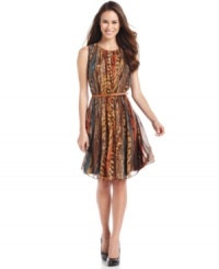 An animal-inspired mixed print and an earthy palette make this Calvin Klein dress a must-have. The feminine silhouette is accentuated with a coordinating belt. An animal-inspired mixed print and an earthy palette make this Calvin Klein dress a must-have. The feminine silhouette is accentuated with a coordinating belt.
