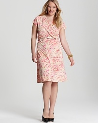 A closet essential, this Jones New York Collection Plus wrap dress pairs a flattering silhouette with delicate florals for feminine charm. A closet essential, this Jones New York Collection Plus wrap dress pairs a flattering silhouette with delicate florals for feminine charm.