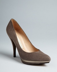 Designer PURA LÓPEZ creates dressed-up, work-perfect pumps with striking gold specchio leather-accented platforms that give them the Midas touch. Designer PURA LÓPEZ creates dressed-up, work-perfect pumps with striking gold specchio leather-accented platforms that give them the Midas touch.