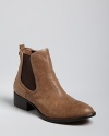 Donald J Pliner's take on the Chelsea bootie goes slightly Western, in rugged, distressed leather.