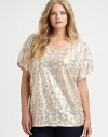 Beyond glamorous, this sequin top features a relaxed-yet-feminine fit. Thus short-sleeve style pairs perfectly with straight-leg or skinny pants.ScoopneckShort sleevesPull-on styleBoxy fitAbout 26 from shoulder to hemViscoseDry cleanImported