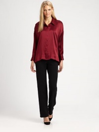 A decidedly feminine take on a classic style, a hammered-silk blouse with dropped shoulders and a hi-lo hem.Shirt collarDropped shouldersButton frontHi-lo hemAbout 27 from shoulder to hemMerino woolDry cleanImportedSIZE & FIT Model shown is 5'10½ (179cm) wearing a US size Small. A decidedly feminine take on a classic style, a hammered-silk blouse with dropped shoulders and a hi-lo hem.Shirt collarDropped shouldersButton frontHi-lo hemAbout 27 from shoulder to hemMerino woolDry cleanImportedSIZE & FIT Model shown is 5'10½ (179cm) wearing a US size Small.