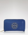 This Tory Burch wallet encapsulates polished ease, finished with a leather-inlaid logo medallion. The continental design unzips to reveal a well-organized interior with a zip pocket and twelve credit card slots.