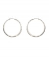 Traditional silver hoops with sparkling crystal accents. Kenneth Cole New York earrings liven any ensemble with a silver tone mixed metal setting and round-cut crystals. Approximate diameter: 1-3/4 inches.
