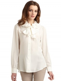 THE LOOKRuffle collarTie-neckButton frontLong sleeves with button cuffsShirttail hemSeamed back yokeTHE FITAbout 27 from shoulder to hemTHE MATERIALSilkCARE & ORIGINDry cleanMade in ItalyModel shown is 5'10 (177cm) wearing US size 4. THE LOOKRuffle collarTie-neckButton frontLong sleeves with button cuffsShirttail hemSeamed back yokeTHE FITAbout 27 from shoulder to hemTHE MATERIALSilkCARE & ORIGINDry cleanMade in ItalyModel shown is 5'10 (177cm) wearing US size 4.