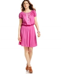A romantic peasant blouse inspired the soft drapes of Sunny Leigh's embroidered dress, perfect for pairing with your favorite sandals to capture the essence of summer. A romantic peasant blouse inspired the soft drapes of Sunny Leigh's embroidered dress, perfect for pairing with your favorite sandals to capture the essence of summer.