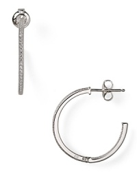 With a crystal-encrusted rim, Chrislu's sterling silver hoop earrings are a classic choice whether worn with denim or more swank with a little black dress and heels. With a crystal-encrusted rim, Chrislu's sterling silver hoop earrings are a classic choice whether worn with denim or more swank with a little black dress and heels.