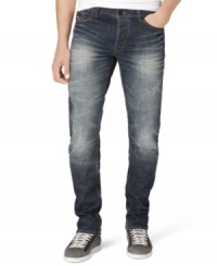 A white fade and distressed details give these Calvin Klein jeans a cool edgy style. A white fade and distressed details give these Calvin Klein jeans a cool edgy style.