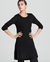 Embrace a minimalist silhouette as clean lines craft an understated DKNY tunic for a chic everyday style. A ruffled hem lends an unexpected touch of texture. Embrace a minimalist silhouette as clean lines craft an understated DKNY tunic for a chic everyday style. A ruffled hem lends an unexpected touch of texture.