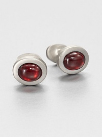 Oval shaped cuff links for the gentleman who commands attention, set in luminous sterling silver set with simulated garnet.Sterling silverGarnetAbout .88 diam.Made in USA Oval shaped cuff links for the gentleman who commands attention, set in luminous sterling silver set with simulated garnet.Sterling silverGarnetAbout .88 diam.Made in USA