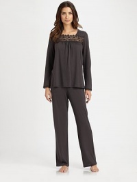A flowy silhouette topped with exquisite lace embroidery and front ruching for added drape. ScoopneckLong sleevesEmbroidered lace at neckline and cuffsFront ruchingElasticized waistbandBody: 70% cotton/30% cashmereLace: polyesterMachine washImported A flowy silhouette topped with exquisite lace embroidery and front ruching for added drape. ScoopneckLong sleevesEmbroidered lace at neckline and cuffsFront ruchingElasticized waistbandBody: 70% cotton/30% cashmereLace: polyesterMachine washImported