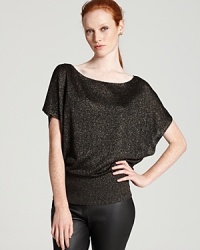 A touch of metallic brings this short sleeve Alice + Olivia sweater over to the shine side, making it the perfect compliment to this season's coated denim trend. A touch of metallic brings this short sleeve Alice + Olivia sweater over to the shine side, making it the perfect compliment to this season's coated denim trend.