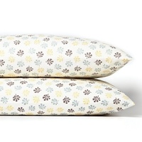 Dappled with a modern floral print in muted hues, these Sky king pillowcases refresh your bedding with contemporary coziness.