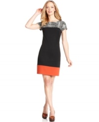 Jessica Howard's petite shift dress is colorblocked with a band of red at the hem and an animal print at the neck and shoulders. Jessica Howard's petite shift dress is colorblocked with a band of red at the hem and an animal print at the neck and shoulders.