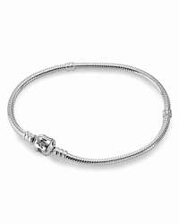 Inspired by the design of PANDORA's iconic bracelets, this sterling silver necklace beautifully displays dozens of charms and clips. Inspired by the design of PANDORA's iconic bracelets, this sterling silver necklace beautifully displays dozens of charms and clips.