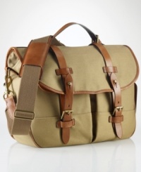 The iconic messenger bag is granted laid-back luxury from a burnished saddle-leather double-buckle closure and embossed signature leather luggage tag for a sharp finish. The iconic messenger bag is granted laid-back luxury from a burnished saddle-leather double-buckle closure and embossed signature leather luggage tag for a sharp finish.