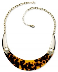 Howl at the moon with this chic crescent-shaped necklace from GUESS. Embellished with sparkling crystal accents and brown tortoise. Crafted in gold tone mixed metal. Approximate length: 16 inches + 2-inch extender. Approximate drop: 1 inch. Howl at the moon with this chic crescent-shaped necklace from GUESS. Embellished with sparkling crystal accents and brown tortoise. Crafted in gold tone mixed metal. Approximate length: 16 inches + 2-inch extender. Approximate drop: 1 inch.
