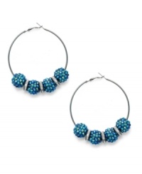 Go for glitter and glam with these hoop earrings from Style&co. A classic silhouette gets energized with blue glitter acrylic stones. Crafted in hematite tone mixed metal. Approximate drop: 2-3/8 inches. Go for glitter and glam with these hoop earrings from Style&co. A classic silhouette gets energized with blue glitter acrylic stones. Crafted in hematite tone mixed metal. Approximate drop: 2-3/8 inches.