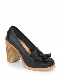 THE LOOKRound toe with stitch detailingCoin keeperLeather tassel accentsStacked heel, 4 (100mm)Stacked platform, ½ (15mm)Compares to a 3½ heel (90mm)THE MATERIALVegetable tanned leather upperLeather lining and front soleRubber back soleORIGINHand-made in SwedenOUR FIT MODEL RECOMMENDS ordering true whole size; ½ sizes should order the next whole size up. THE LOOKRound toe with stitch detailingCoin keeperLeather tassel accentsStacked heel, 4 (100mm)Stacked platform, ½ (15mm)Compares to a 3½ heel (90mm)THE MATERIALVegetable tanned leather upperLeather lining and front soleRubber back soleORIGINHand-made in SwedenOUR FIT MODEL RECOMMENDS ordering true whole size; ½ sizes should order the next whole size up.