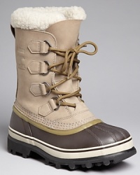 This rugged all-weather boot from Sorel keeps you warm, dry and looking great under any conditions, with a rubber shell toe and sides, waterproof leather upper and cozy faux shearling cuff. This rugged all-weather boot from Sorel keeps you warm, dry and looking great under any conditions, with a rubber shell toe and sides, waterproof leather upper and cozy faux shearling cuff.