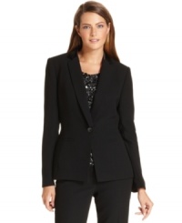 Sharp tuxedo styling elevates Calvin Klein's single-button blazer, while satin lapels amp up the glamorous look. Sharp tuxedo styling elevates Calvin Klein's single-button blazer, while satin lapels amp up the glamorous look.