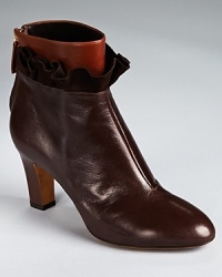 All-out ladylike, Moschino Cheap and Chic's ruffle-trimmed Carol booties reach their true potential when paired with wool tights and a leather shift. All-out ladylike, Moschino Cheap and Chic's ruffle-trimmed Carol booties reach their true potential when paired with wool tights and a leather shift.