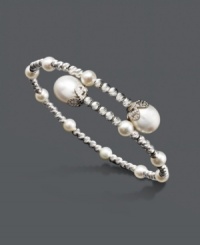 Portray a look that exudes elegance. Bracelet features a wrapped cuff design accented by cultured freshwater pearls (4-1/2-5 mm and 8-1/2-9 mm) and sterling silver sparkle beads. Approximate length: 7-1/2 inches. Portray a look that exudes elegance. Bracelet features a wrapped cuff design accented by cultured freshwater pearls (4-1/2-5 mm and 8-1/2-9 mm) and sterling silver sparkle beads. Approximate length: 7-1/2 inches.