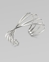 A structural piece in a twisted multi-row design. Sterling silverSlip-on styleDiameter, about 2¼Imported 