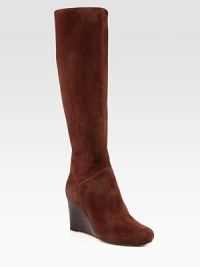 A stacked wedge heightens this casual favorite, rendered in buttery suede. Stacked wedge, 3¼ (80mm)Shaft, 16¼Leg circumference, 13Suede upperSide zipLeather liningRubber solePadded insoleImportedOUR FIT MODEL RECOMMENDS ordering true size. A stacked wedge heightens this casual favorite, rendered in buttery suede. Stacked wedge, 3¼ (80mm)Shaft, 16¼Leg circumference, 13Suede upperSide zipLeather liningRubber solePadded insoleImportedOUR FIT MODEL RECOMMENDS ordering true size.