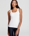 Ribbed tank with scooped neckline. Pulls on over head. Bra-friendly. Longer length.