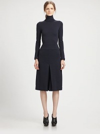 This chic, artfully tailored one-piece features a flattering culotte silhouette.TurtleneckLong sleevesPanel constructionInverted front and back pleatsConcealed back zipSilk liningAbout 44 from shoulder to hemWoolDry cleanMade in USA of Italian fabricModel shown is 5'10 (177cm) wearing US size 4. This chic, artfully tailored one-piece features a flattering culotte silhouette.TurtleneckLong sleevesPanel constructionInverted front and back pleatsConcealed back zipSilk liningAbout 44 from shoulder to hemWoolDry cleanMade in USA of Italian fabricModel shown is 5'10 (177cm) wearing US size 4.