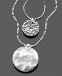 Emblematic style by Kenneth Cole New York. This beautiful two-strand pendant features crystal accents set in silvertone mixed metal. Approximate outer chain length: 18 inches + 3-1/2-inch extender. Approximate inner chain length: 16 inches. Approximate large pendant diameter: 1-3/4 inches. Approximate small pendant diameter: 1/2 inch. Emblematic style by Kenneth Cole New York. This beautiful two-strand pendant features crystal accents set in silvertone mixed metal. Approximate outer chain length: 18 inches + 3-1/2-inch extender. Approximate inner chain length: 16 inches. Approximate large pendant diameter: 1-3/4 inches. Approximate small pendant diameter: 1/2 inch.