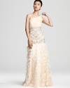 This elaborate Sue Wong gown gets glamorous with detailed beading and a dramatic, petal and feather accented skirt.