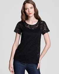Sheer lace carefully climbs the length of this DKNY tee for an effortlessly romantic spirit.