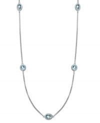 Long and luxurious. This pretty strand necklace features round and oval-cut stations of blue topaz (12 ct. t.w.) on a delicate sterling silver chain. Approximate length: 36 inches. Long and luxurious. This pretty strand necklace features round and oval-cut stations of blue topaz (12 ct. t.w.) on a delicate sterling silver chain. Approximate length: 36 inches.