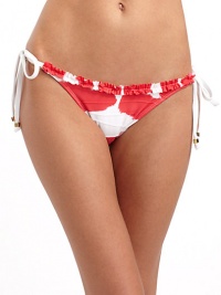THE LOOKRuffled trimSide tiesElastic waist and leg openingsTHE MATERIAL80% nylon/20% spandexCARE & ORIGINHand washMade in USAPlease note: Bikini top sold separately. THE LOOKRuffled trimSide tiesElastic waist and leg openingsTHE MATERIAL80% nylon/20% spandexCARE & ORIGINHand washMade in USAPlease note: Bikini top sold separately.