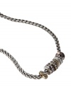 Fossil hits a vintage note with this chain necklace. Multitone mixed metal crystal-accented rondelle beads hang like miniature rings from a silvertone wheat chain. Approximate length: 16 inches.