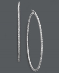 Extra large hoops make for red-carpet worthy style. Sparkling diamond accents add shimmer to a large sterling silver setting. Approximate diameter: 2-1/4 inches.