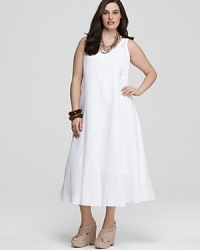 Lightweight linen eases into an effortless Eileen Fisher maxi dress, designed with delicate slim ties at the waist to define the long silhouette. Lightweight linen eases into an effortless Eileen Fisher maxi dress, designed with delicate slim ties at the waist to define the long silhouette.