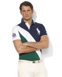 Designed exclusively for Ralph Lauren's collection celebrating the Wimbledon Championships, a classic short-sleeved polo shirt is tailored for a trim, athletic fit from breathable cotton mesh in a preppy color-blocked design. Designed exclusively for Ralph Lauren's collection celebrating the Wimbledon Championships, a classic short-sleeved polo shirt is tailored for a trim, athletic fit from breathable cotton mesh in a preppy color-blocked design.