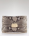 MICHAEL Michael Kors' embossed python clutch lends exotic appeal after hours. Dual purpose, this convertible bag is equally enticing over the shoulder or tucked under a LBD.
