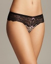 A fierce and fun animal print mesh low-rise thong with contrast bow accents. Style #722314